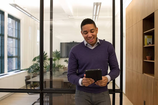 A male employee researching the key features and capabilities of Interfax for modern business needs